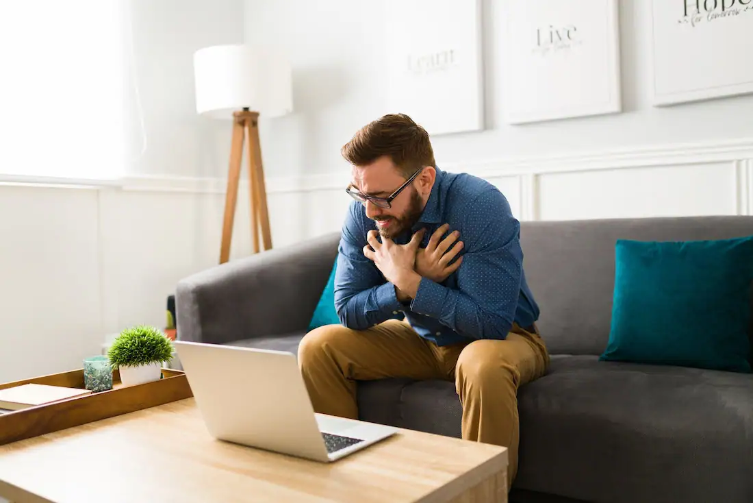 A man participates in an online support group.